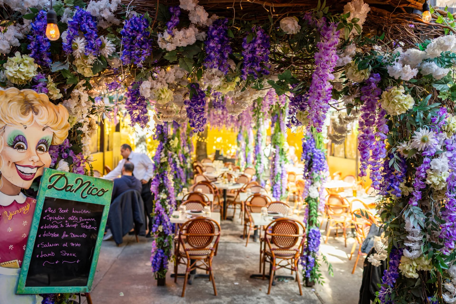 Garden patio with umbrella tables outside Da Nico Ristorante in Little Italy